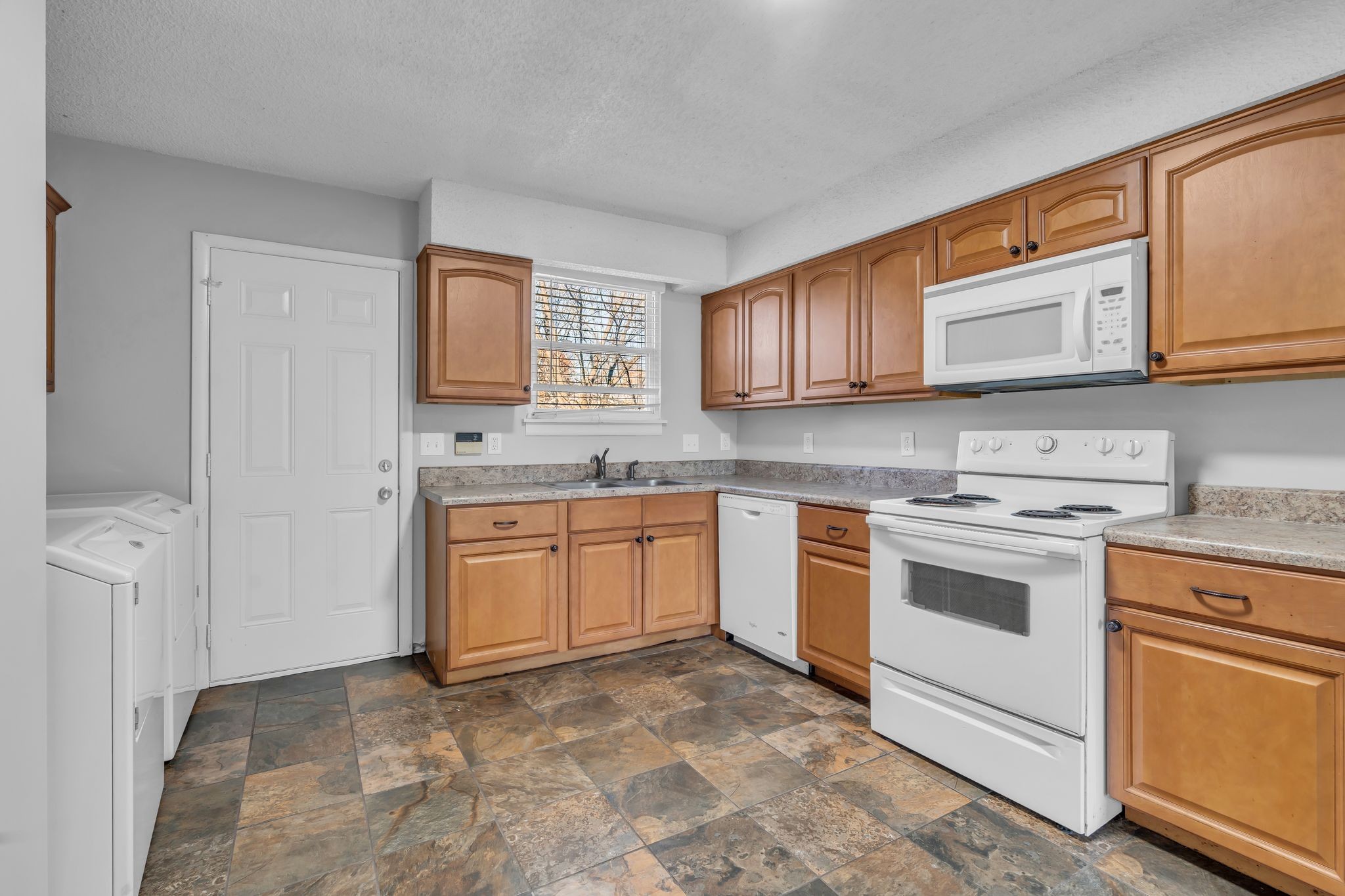 4643 Forest Ridge Drive Hermitage, TN 37076 - Photo 11 of 32 a kitchen with a stove sink and cabinets