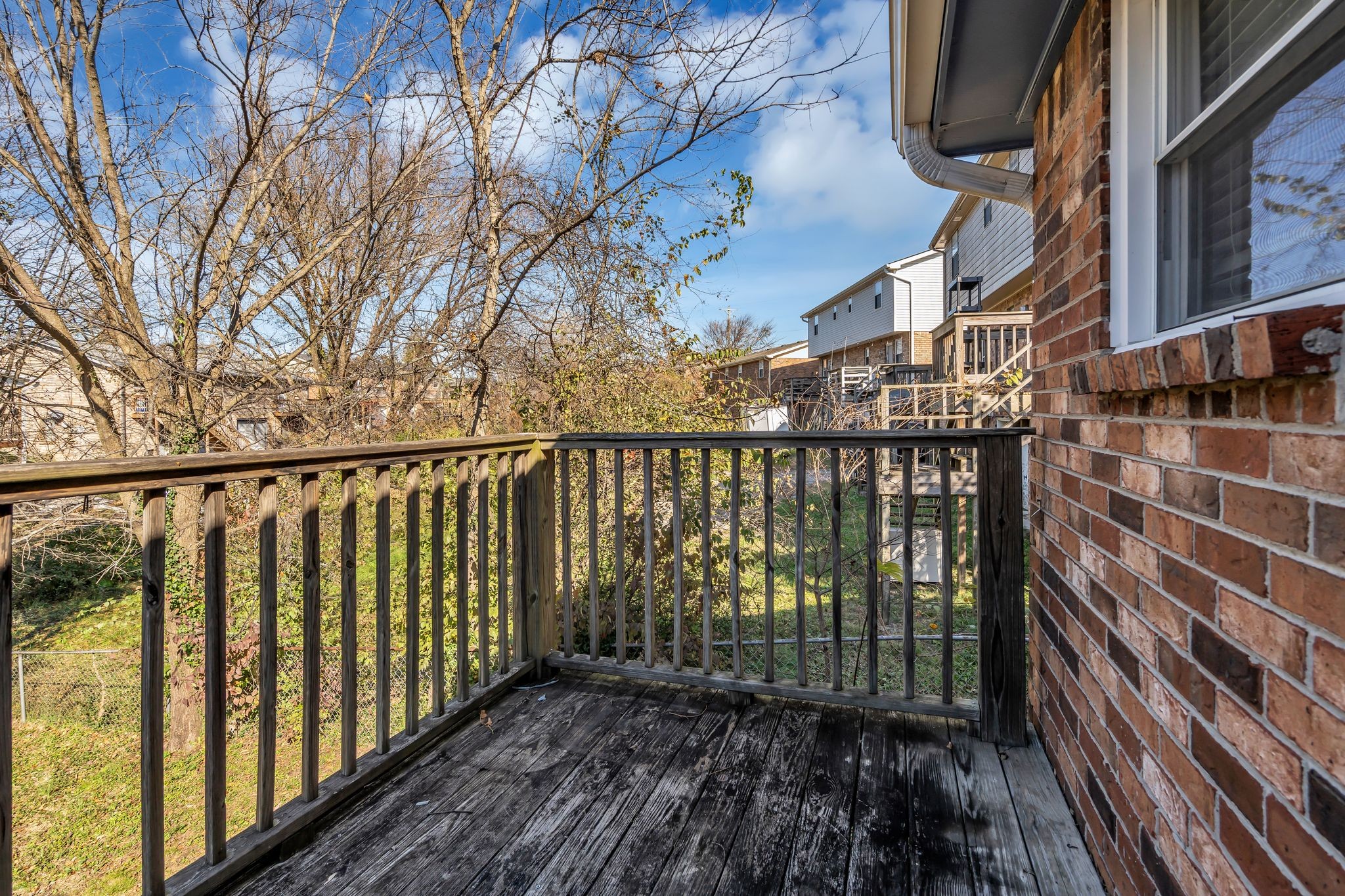 4643 Forest Ridge Drive Hermitage, TN 37076 - Photo 26 of 32 a view of a balcony with wooden floor and fence