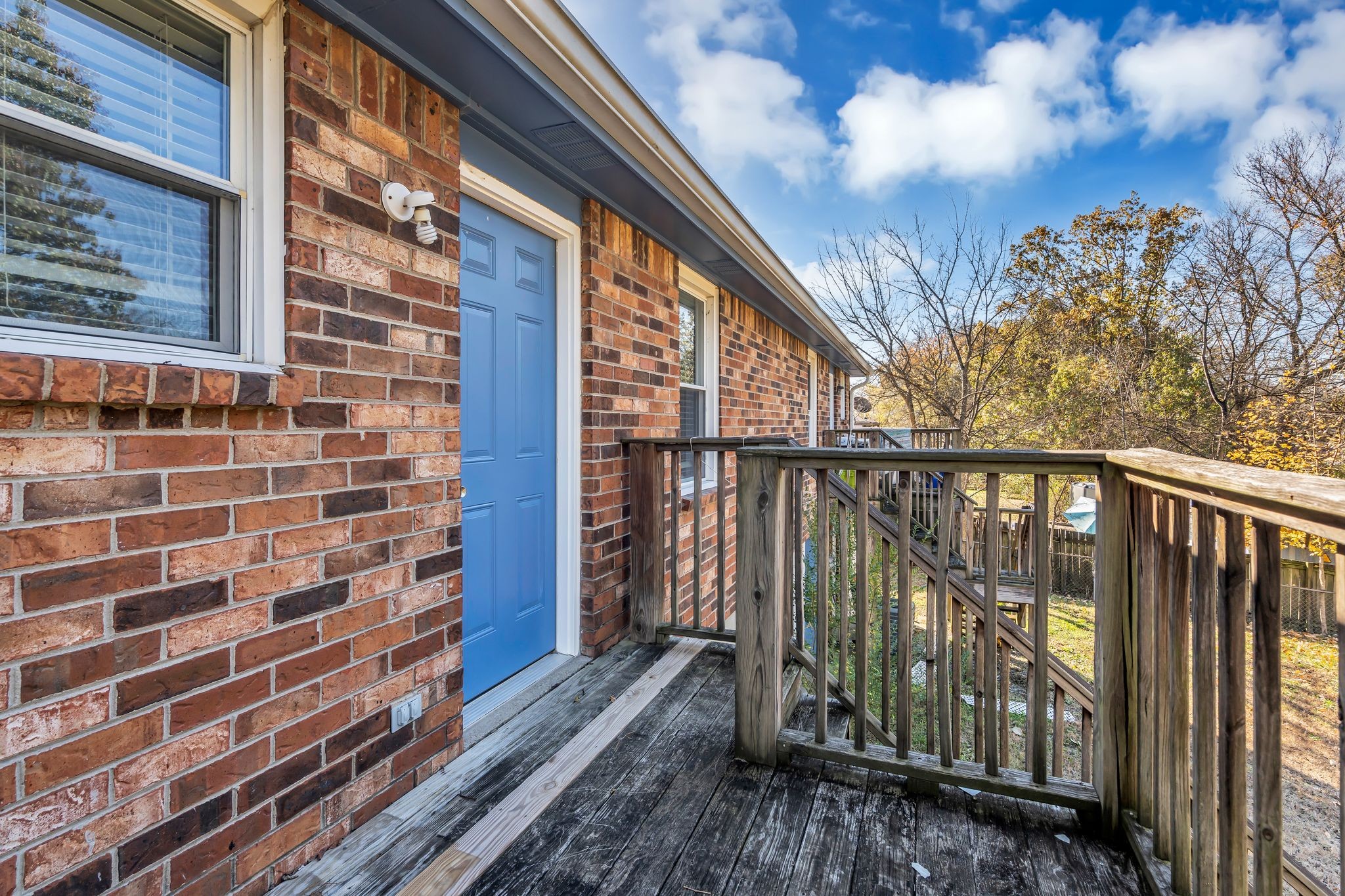 4643 Forest Ridge Drive Hermitage, TN 37076 - Photo 27 of 32 a view of a balcony with wooden floor and fence