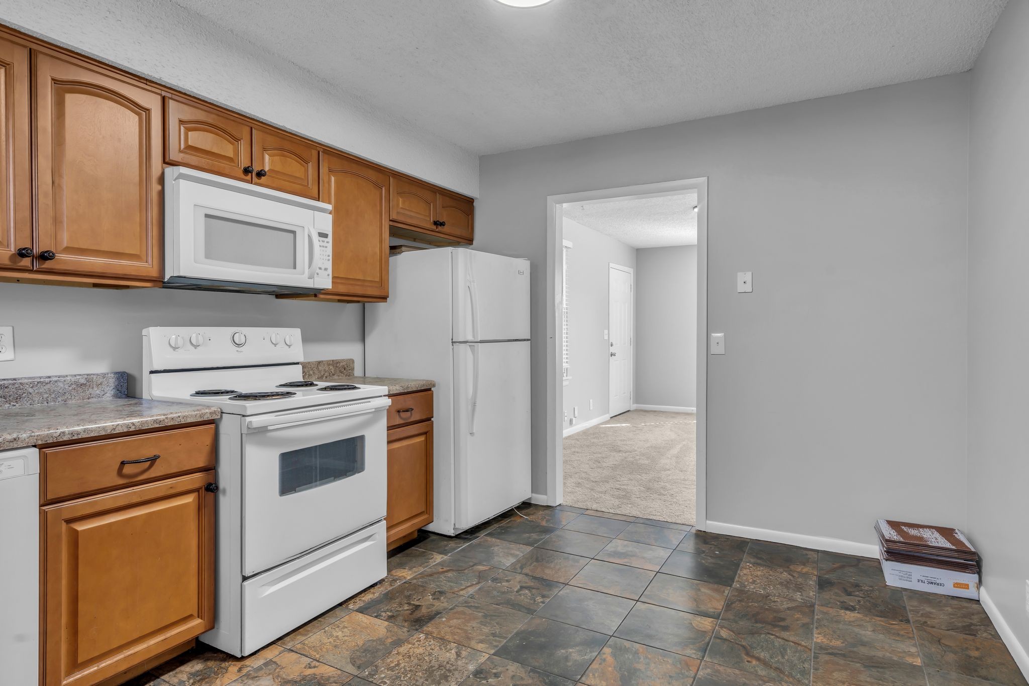 4643 Forest Ridge Drive Hermitage, TN 37076 - Photo 9 of 32 a kitchen with a stove a refrigerator and a cabinets