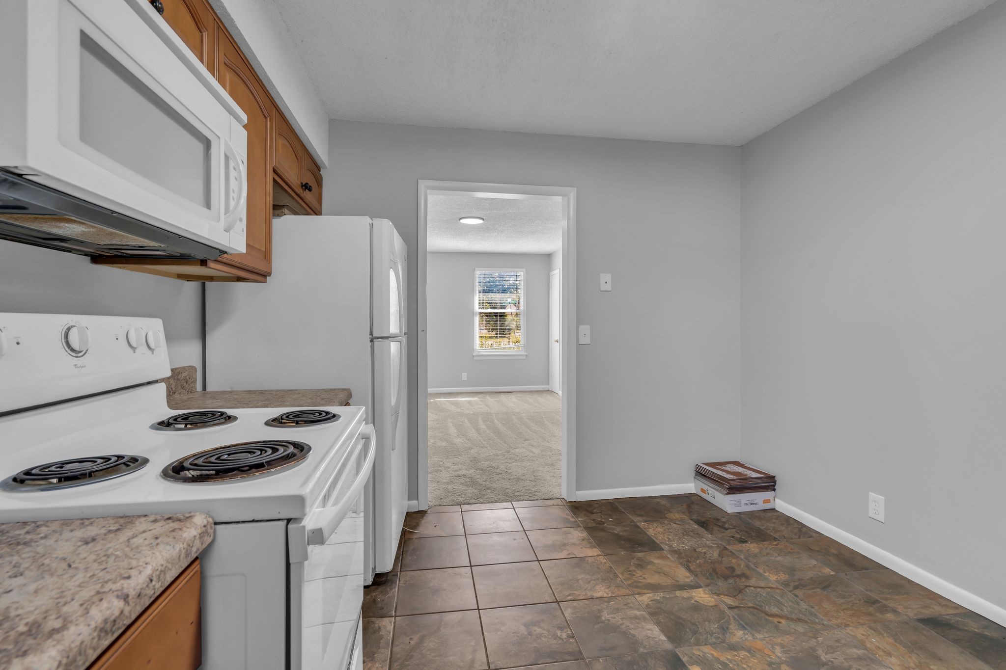 4643 Forest Ridge Drive Hermitage, TN 37076 - Photo 10 of 32 a kitchen with a stove a refrigerator and cabinets