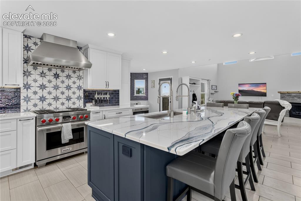 11662 Rio Secco Road Peyton, CO 80831 - Photo 7 of 29 Granite counters w/ undermount sink featuring dual faucets