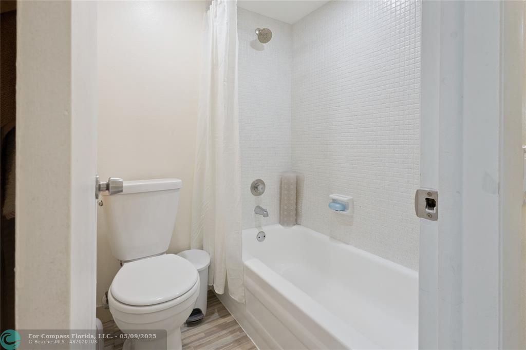 9400 Lime Bay Boulevard, Unit 214 Tamarac, FL 33321 - Photo 6 of 17 a bathroom with a sink and a toilet