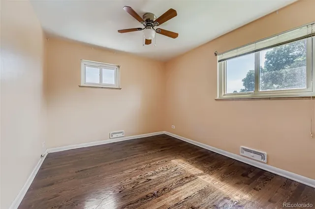 a view of room with window and ceiling fan