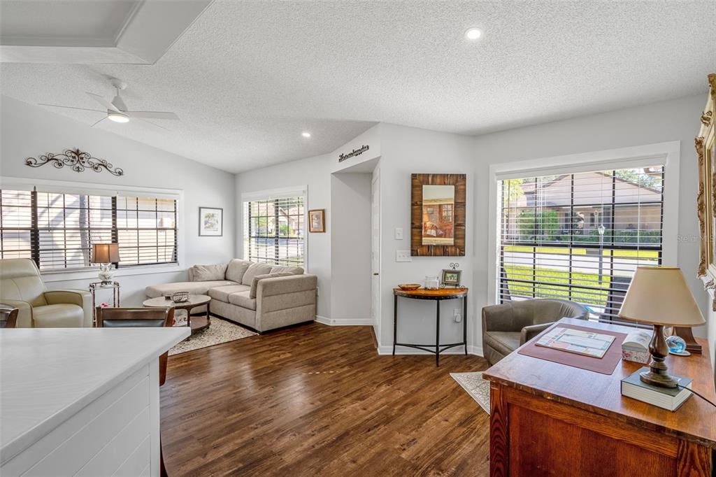 6732 Oak Cluster Circle Spring Hill, FL 34606 - Photo 12 of 65 a living room with furniture and a window