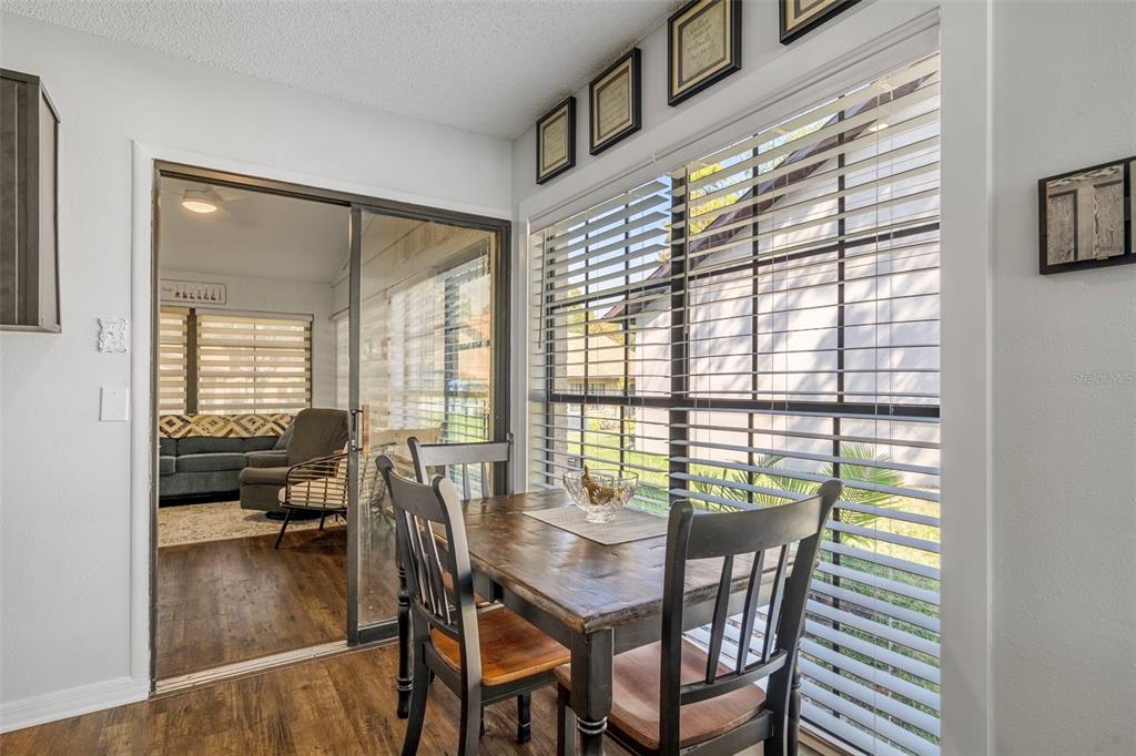 6732 Oak Cluster Circle Spring Hill, FL 34606 - Photo 21 of 65 a view of a dining room with furniture window and outside view