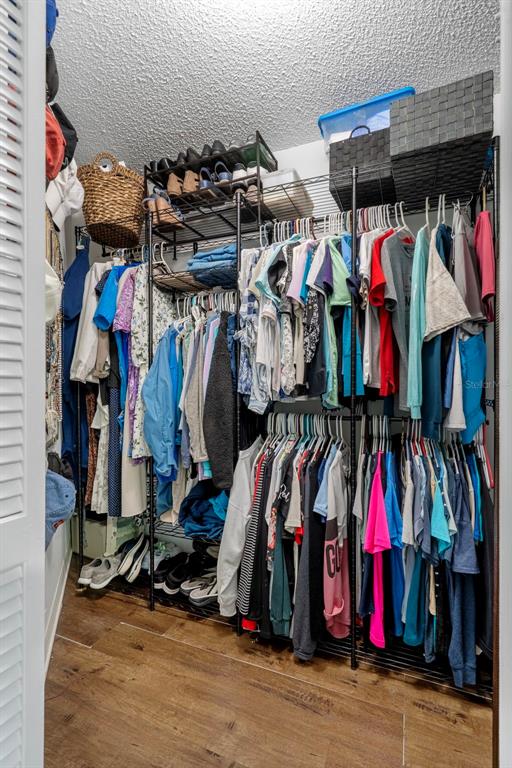 6732 Oak Cluster Circle Spring Hill, FL 34606 - Photo 30 of 65 a view of walk in closet with clothes