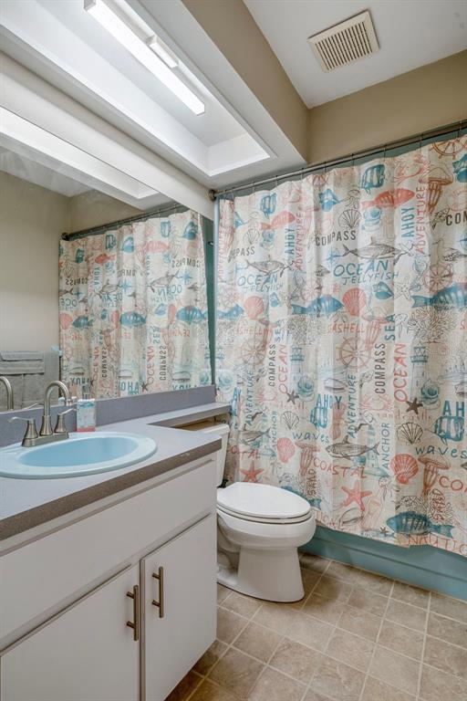 6732 Oak Cluster Circle Spring Hill, FL 34606 - Photo 32 of 65 a bathroom with a sink toilet and shower