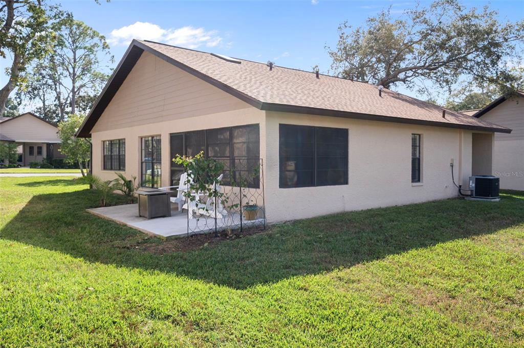 6732 Oak Cluster Circle Spring Hill, FL 34606 - Photo 40 of 65 a view of a house with backyard and sitting area