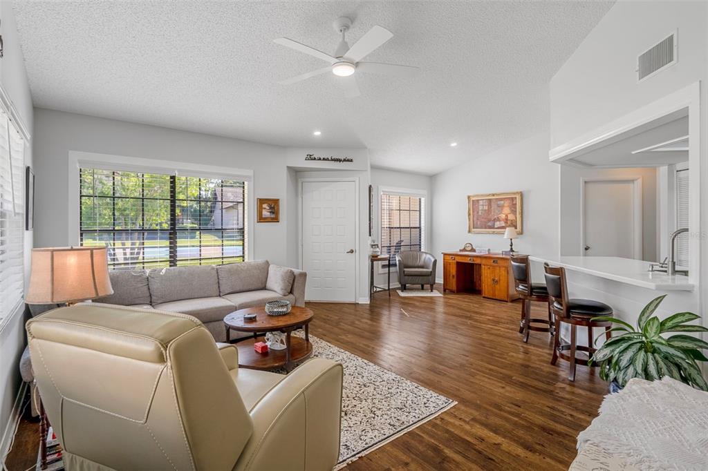 6732 Oak Cluster Circle Spring Hill, FL 34606 - Photo 8 of 65 a living room with furniture and a large window