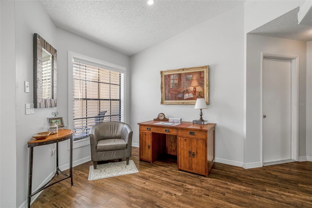 6732 Oak Cluster Circle Spring Hill, FL 34606 - Photo 10 of 65 a living room with furniture and a window