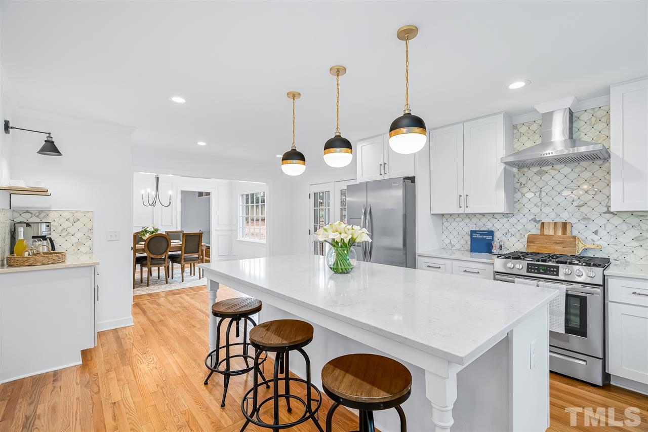 920 East Millbrook Road Raleigh, NC 27609 - Photo 14 of 30 a kitchen with sink and wooden floor
