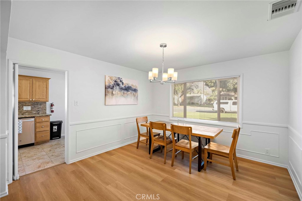 720 East Foothill Boulevard Glendora, CA 91741 - Photo 13 of 37 a view of a dining room with furniture and wooden floor