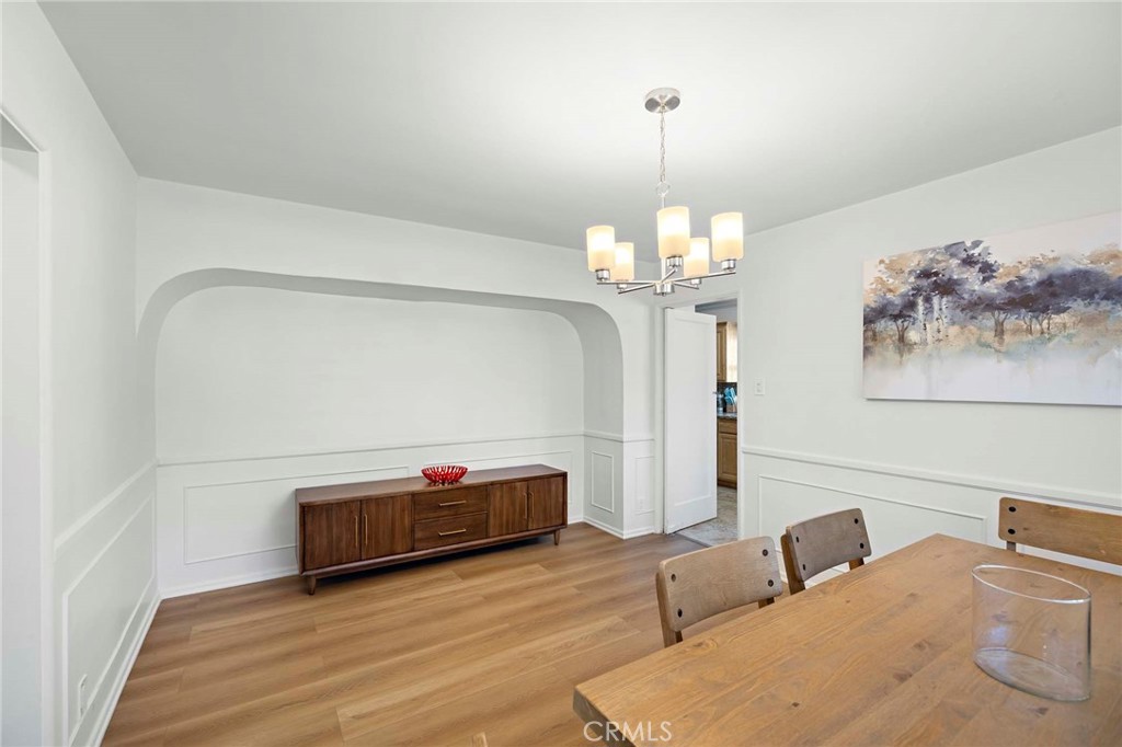 720 East Foothill Boulevard Glendora, CA 91741 - Photo 14 of 37 a living room with furniture a chandelier and a wooden floor