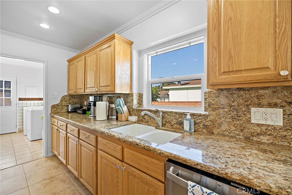 720 East Foothill Boulevard Glendora, CA 91741 - Photo 16 of 37 a kitchen with stainless steel appliances granite countertop a sink a stove and cabinets