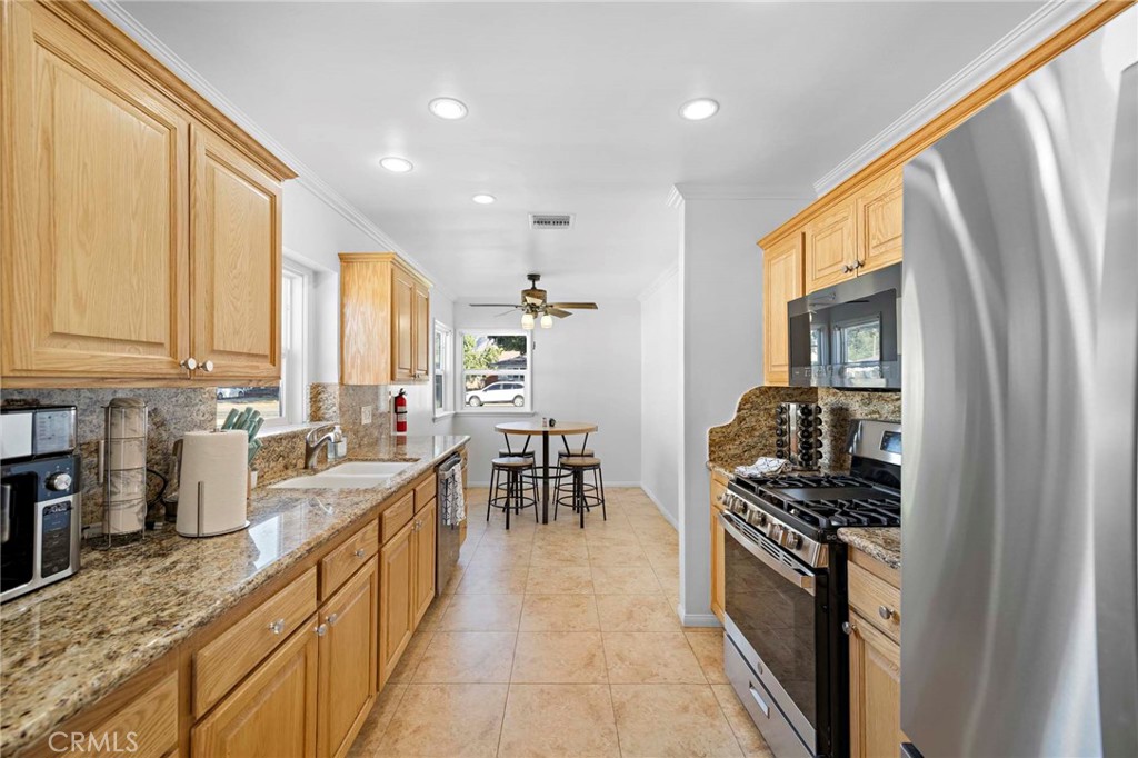 720 East Foothill Boulevard Glendora, CA 91741 - Photo 18 of 37 a kitchen with stainless steel appliances granite countertop a stove a sink and a refrigerator