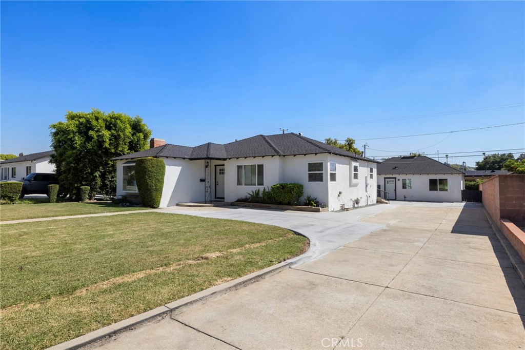 720 East Foothill Boulevard Glendora, CA 91741 - Photo 2 of 37 a front view of a house with a yard