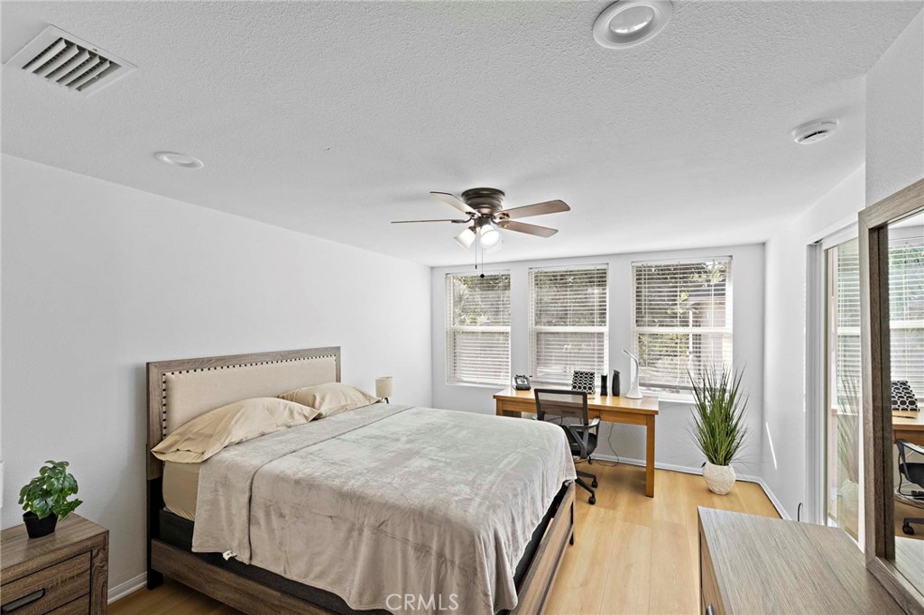 720 East Foothill Boulevard Glendora, CA 91741 - Photo 24 of 37 a bedroom with a bed and a large window