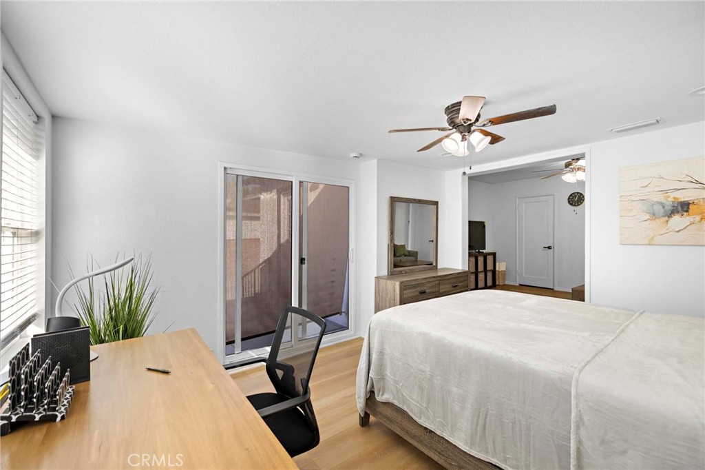 720 East Foothill Boulevard Glendora, CA 91741 - Photo 25 of 37 a bedroom with a bed and a chandelier