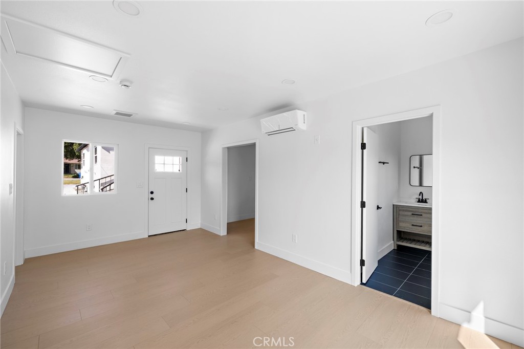 720 East Foothill Boulevard Glendora, CA 91741 - Photo 29 of 37 a view of empty room with wooden floor and window