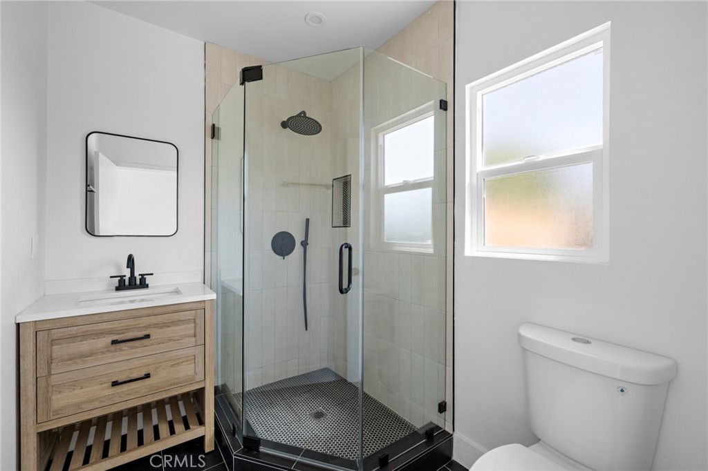 720 East Foothill Boulevard Glendora, CA 91741 - Photo 36 of 37 a bathroom with a sink toilet and shower