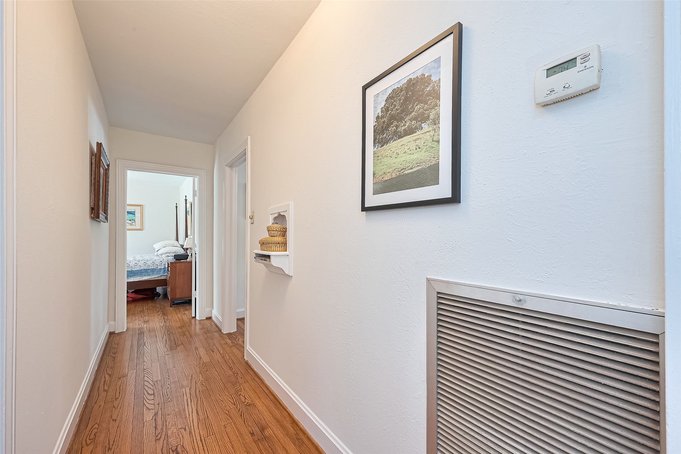 501 Gale Street Houston, TX 77009 - Photo 16 of 49 a view of a hallway with wooden floor and a bathroom