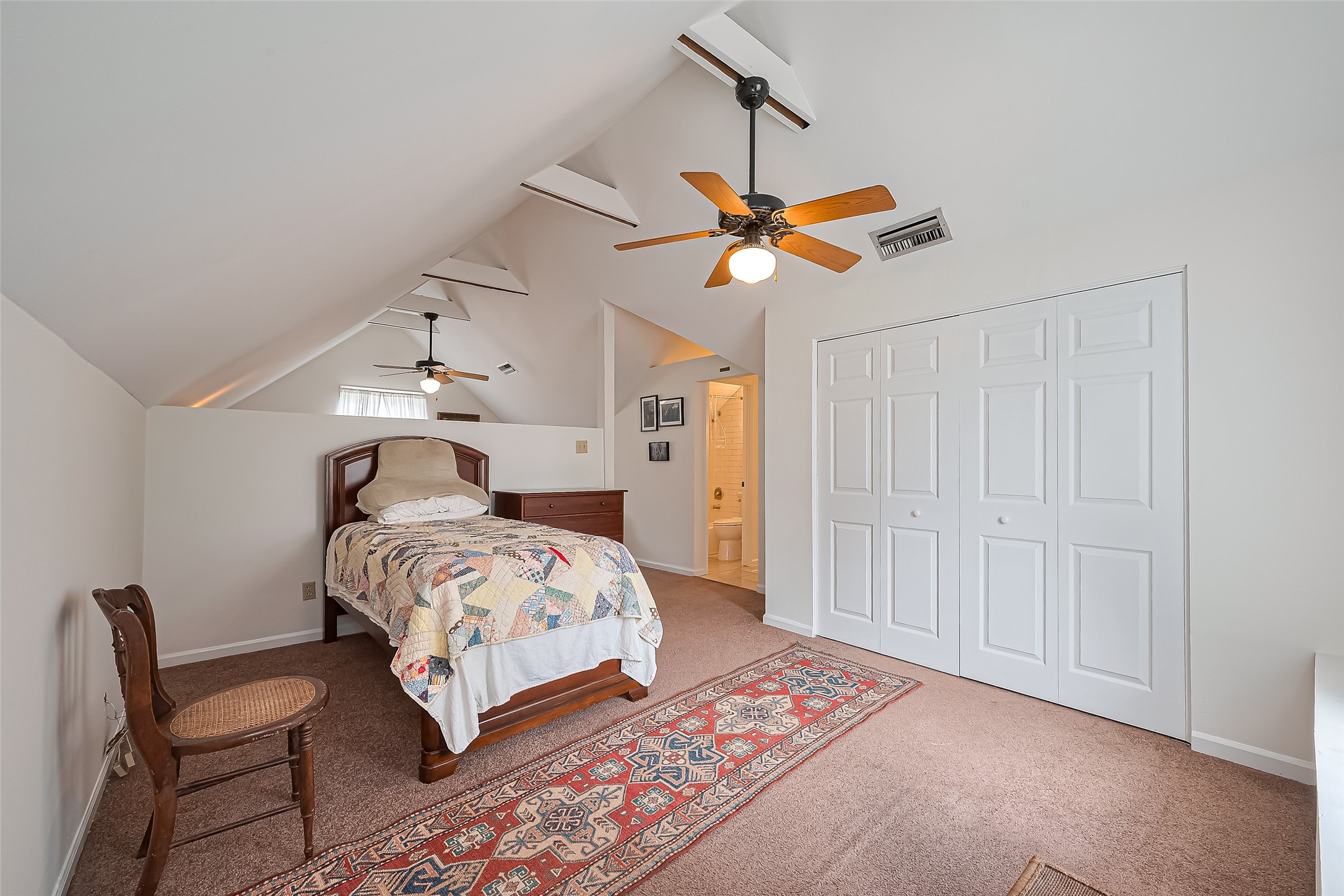 501 Gale Street Houston, TX 77009 - Photo 26 of 49 a bedroom with a bed a chandelier and closet