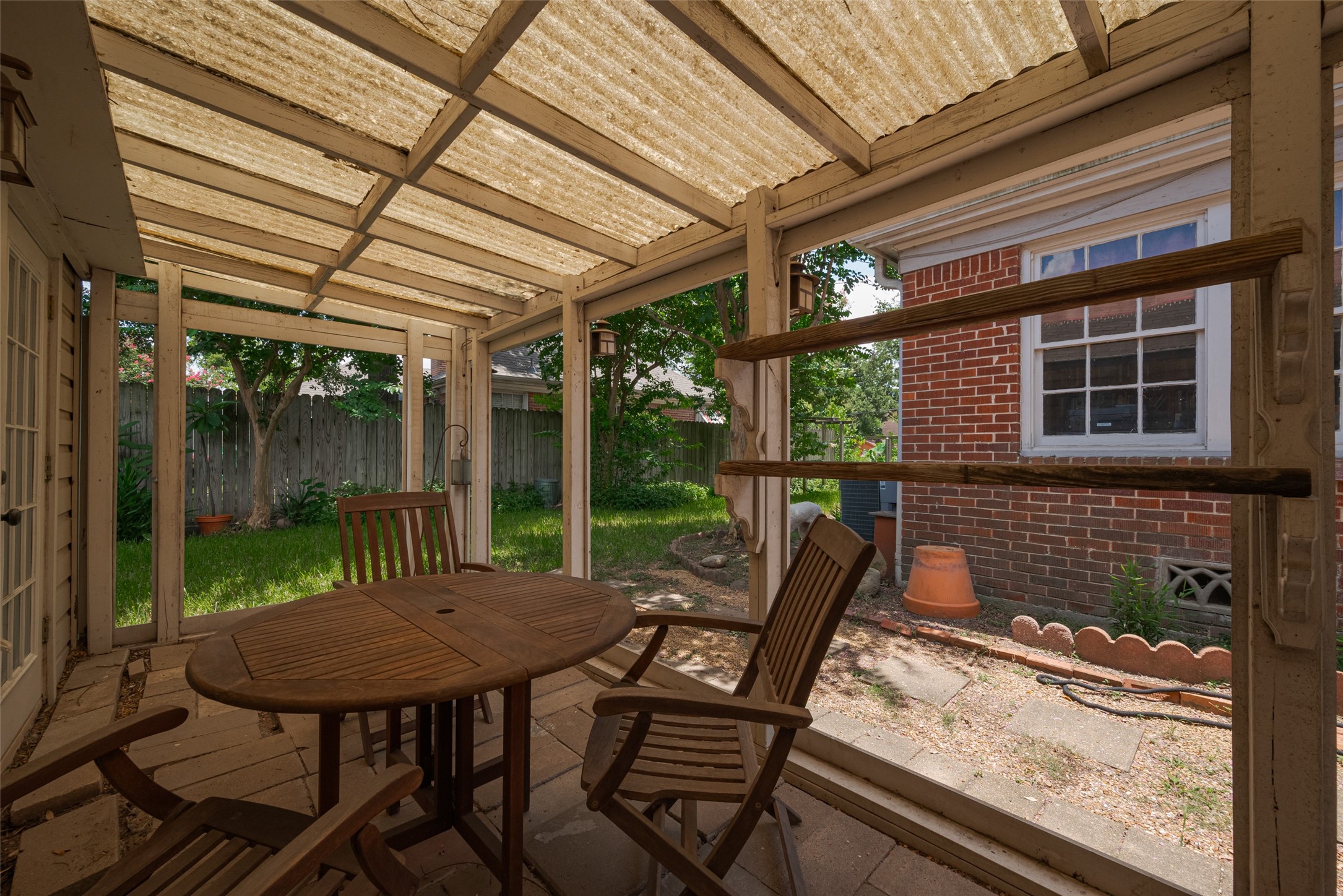 501 Gale Street Houston, TX 77009 - Photo 28 of 49 a view of a patio with table and chairs next to a yard