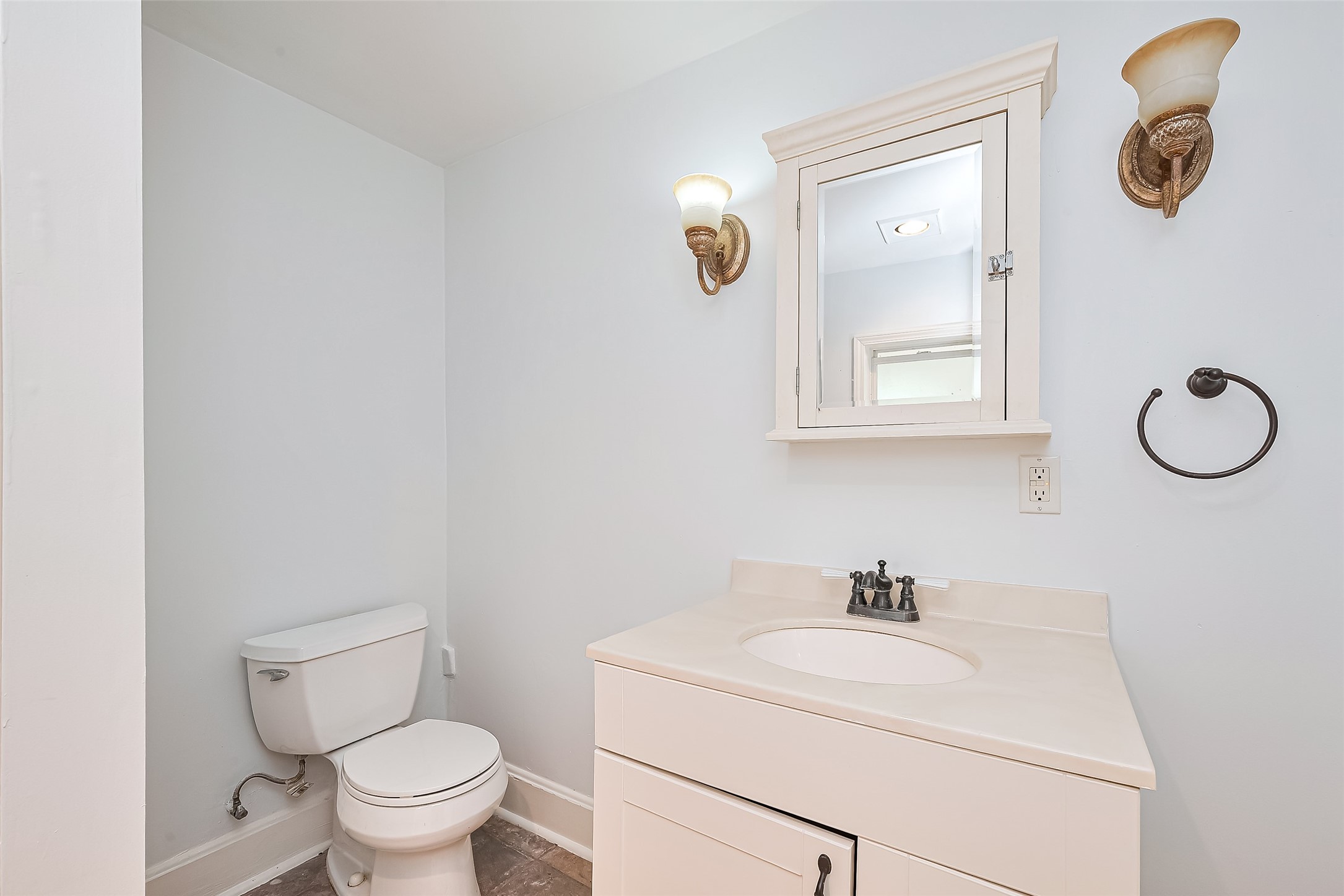 501 Gale Street Houston, TX 77009 - Photo 35 of 49 a bathroom with a toilet sink vanity and mirror