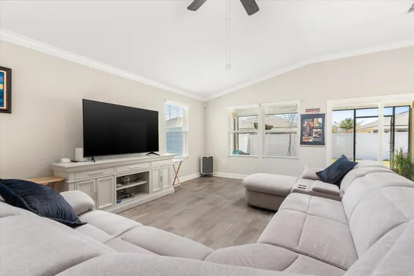 a bedroom with furniture and a chandelier