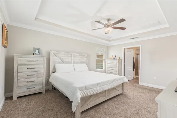 a bathroom with a double vanity sink mirror and shower