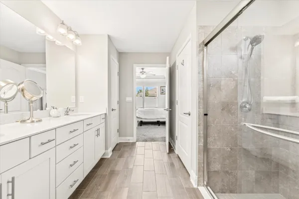 a view of walk in closet with clothes