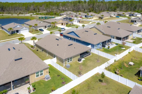 an aerial view of a house with a swimming pool