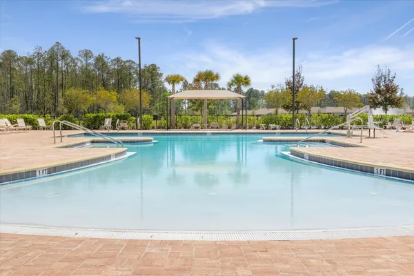 a view of houses with outdoor space and parking