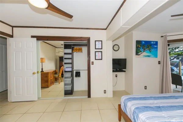 a bedroom with a bed and a mirror