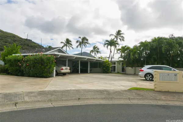 a view of a parked car in front of a house