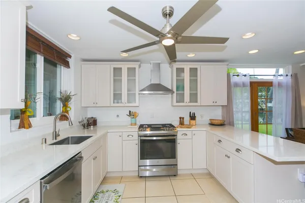 a kitchen with a sink cabinets and window