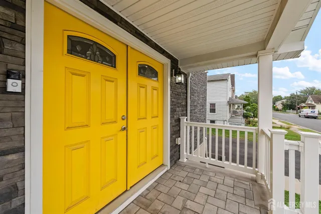 a kitchen with kitchen island granite countertop a sink appliances cabinets and a counter top space