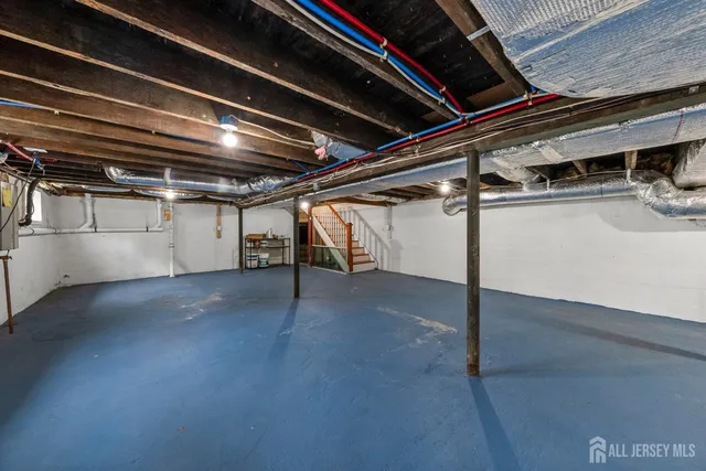 a bathroom with a granite countertop sink a toilet and a shower