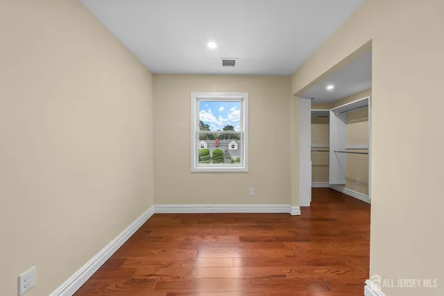 a bathroom with a double vanity sink a toilet and a mirror