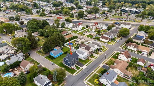 an aerial view of residential building and lake