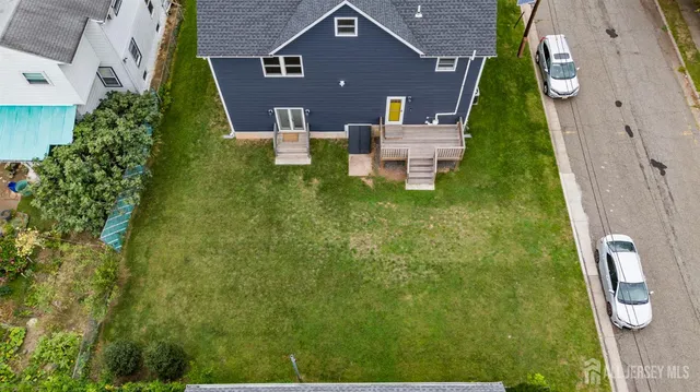 an aerial view of a house with a garden