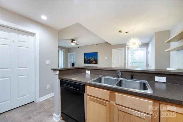 a kitchen with stainless steel appliances granite countertop a sink and a granite counter tops