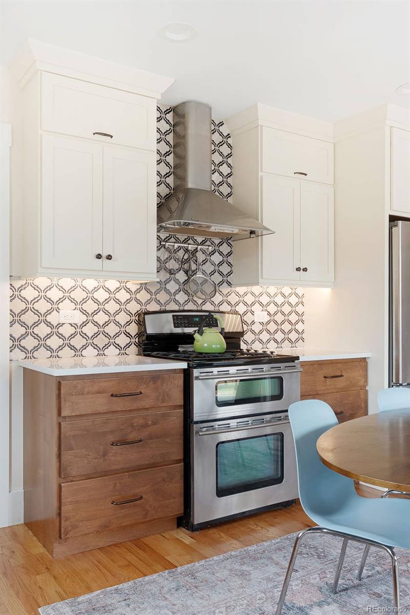 1959 South Washington Street Denver, CO 80210 - Photo 23 of 50 a stove top oven sitting inside of a kitchen