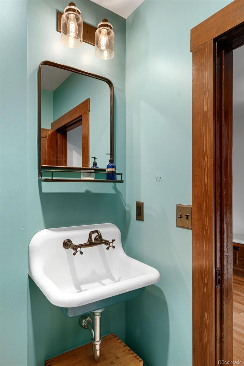 1959 South Washington Street Denver, CO 80210 - Photo 26 of 50 a bathroom with a sink and a mirror