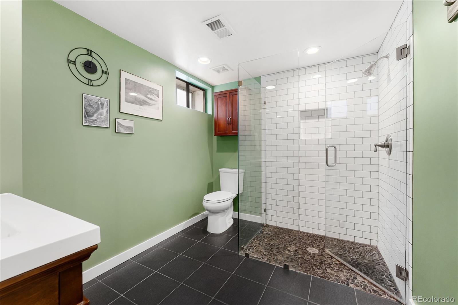 1959 South Washington Street Denver, CO 80210 - Photo 41 of 50 a bathroom with a toilet and a shower