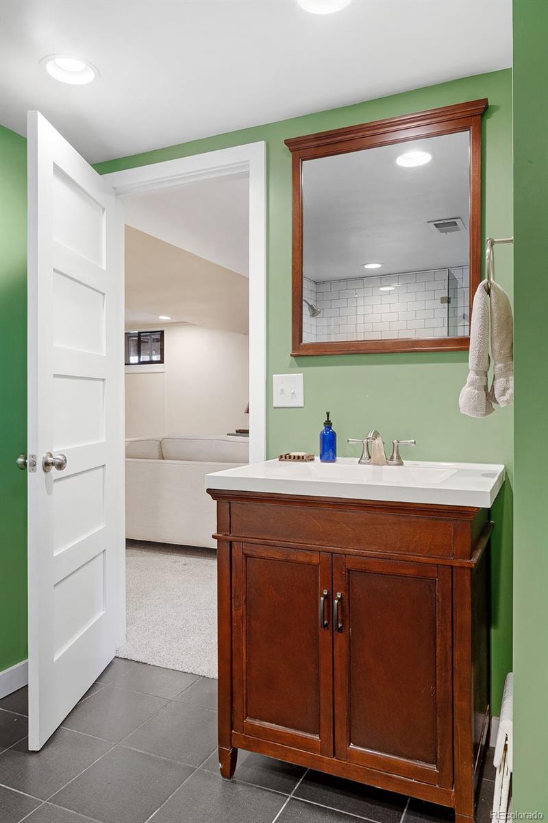 1959 South Washington Street Denver, CO 80210 - Photo 42 of 50 a bathroom with a sink and a mirror