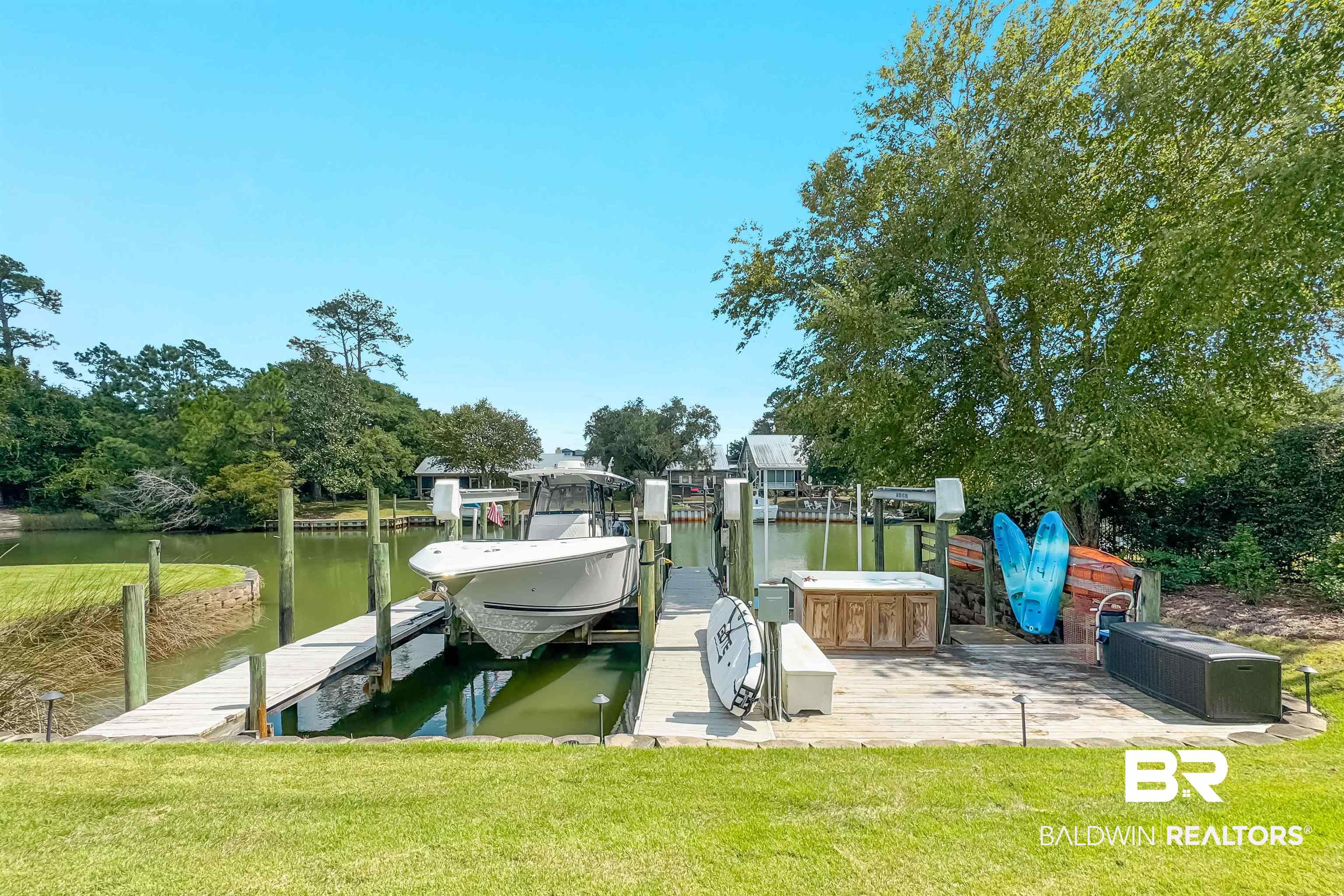 6630 East Quarry Drive Elberta, AL 36530 - Photo 47 of 63 Dock area with boat lift, a water view, and a lawn