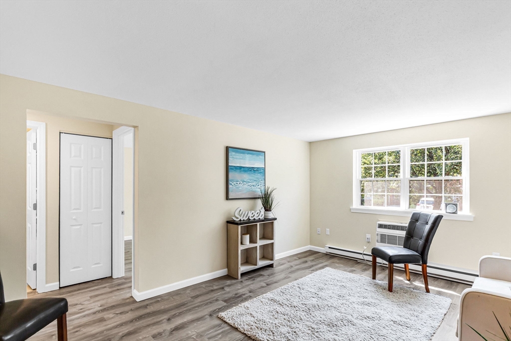 33 Maple Crest Circle, Unit D Holyoke, MA 01040 - Photo 11 of 28 a workspace with wooden floor and a window