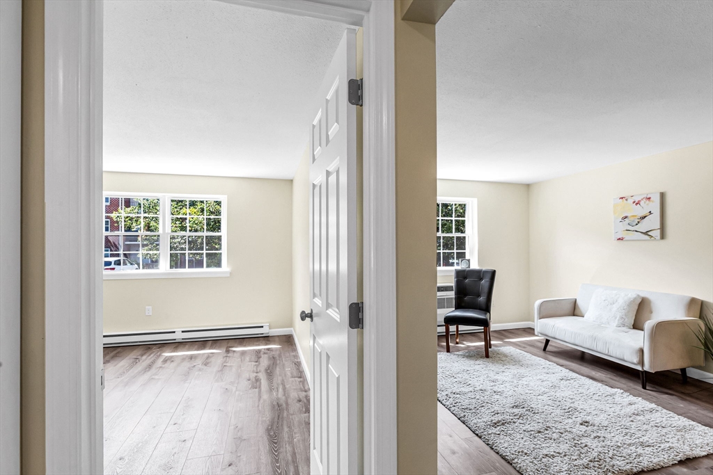 33 Maple Crest Circle, Unit D Holyoke, MA 01040 - Photo 12 of 28 a living room with furniture and a window